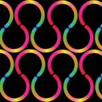 A vector illustration of a seamless pattern of interlocking pink, yellow, and blue curved shapes on black