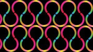 A vector illustration of a seamless pattern of interlocking pink, yellow, and blue curved shapes on black